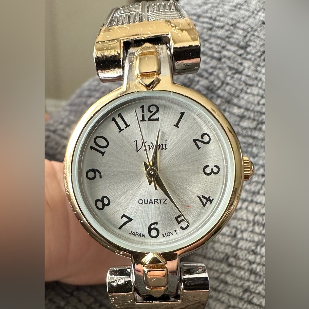 Women’s Vivani quartz (spring loaded band) watch.